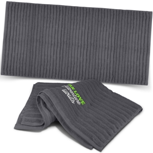 luxurious charcoal grey bath towel shown with and without a logo