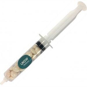 plastic syringe filled with white chewy mints