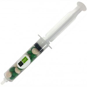 clear plastic syringe filled with green and white chewy fruits