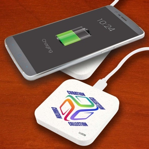 wireless fast charger shown with custom printed logo and phone being charged