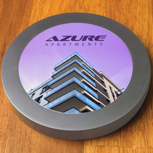 aluminimum wireless fast charger shown with full colour printed custom logo